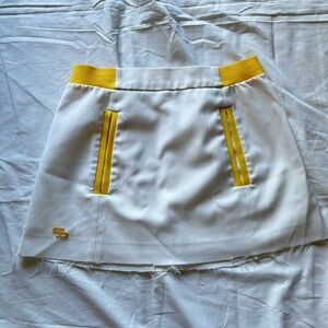 Top Seed white and yellow cut off tennis skirt with pockets!!
